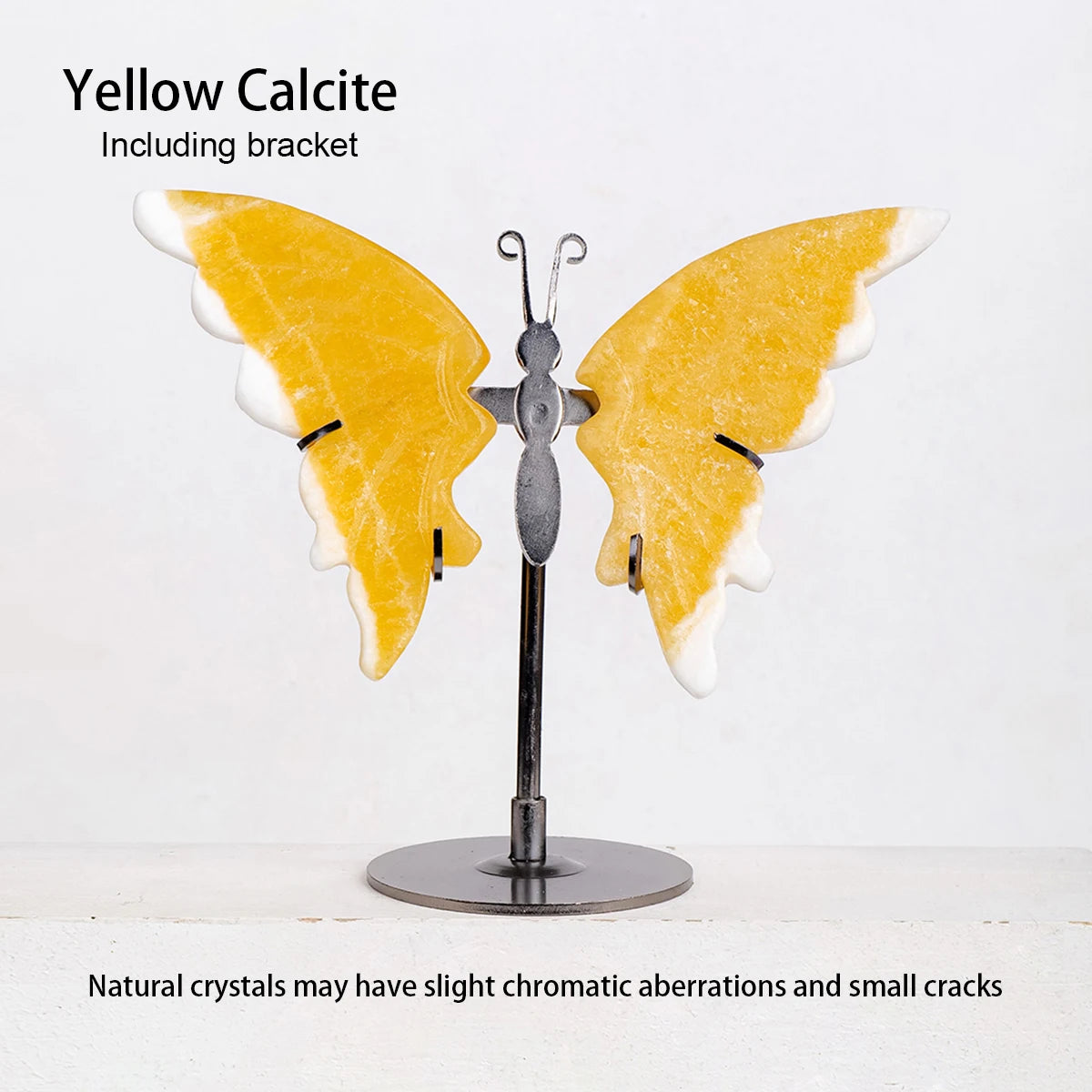 Yellow calcite crystal butterfly on a stand with text about natural crystals.