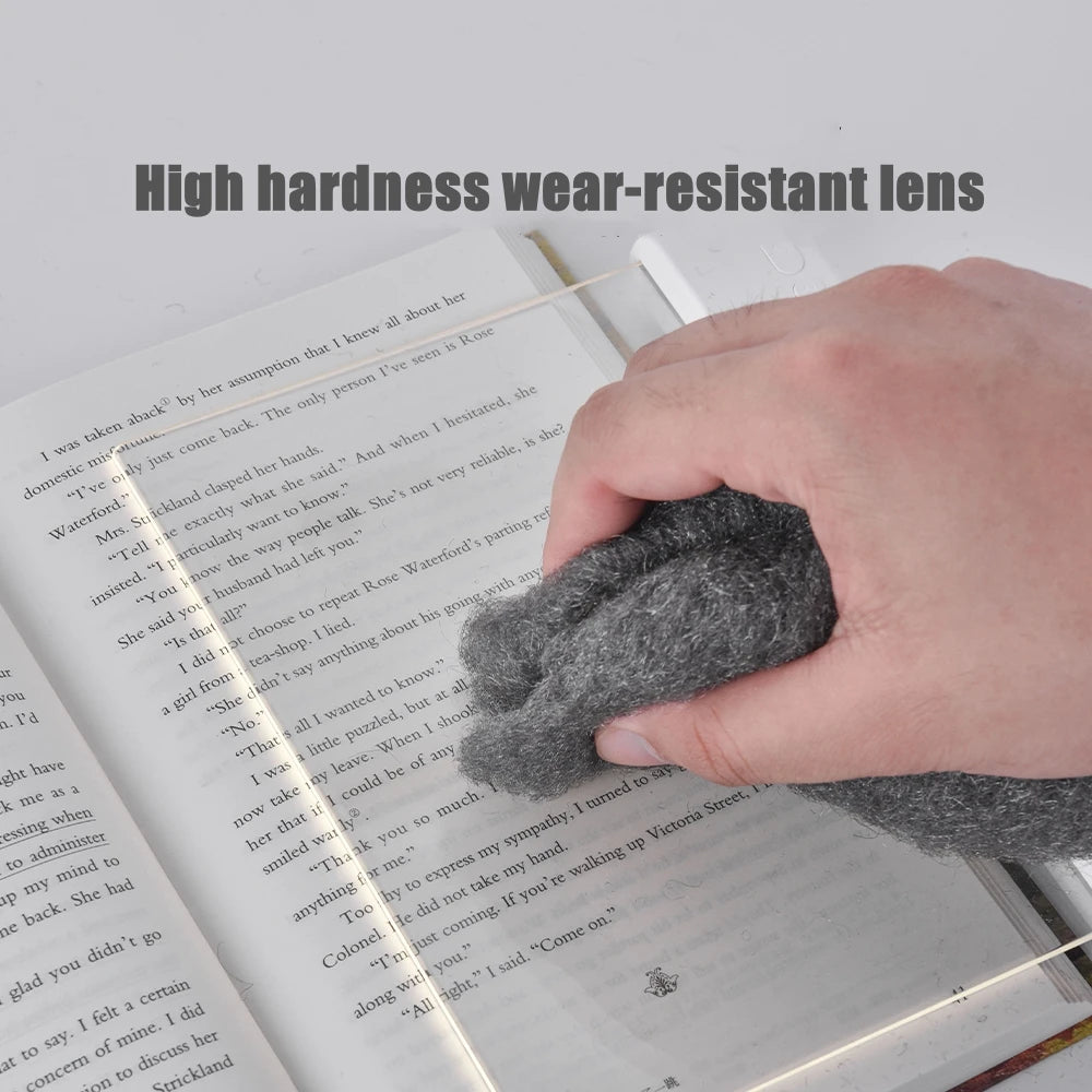 Person cleaning a book with a high-hardness wear-resistant lens