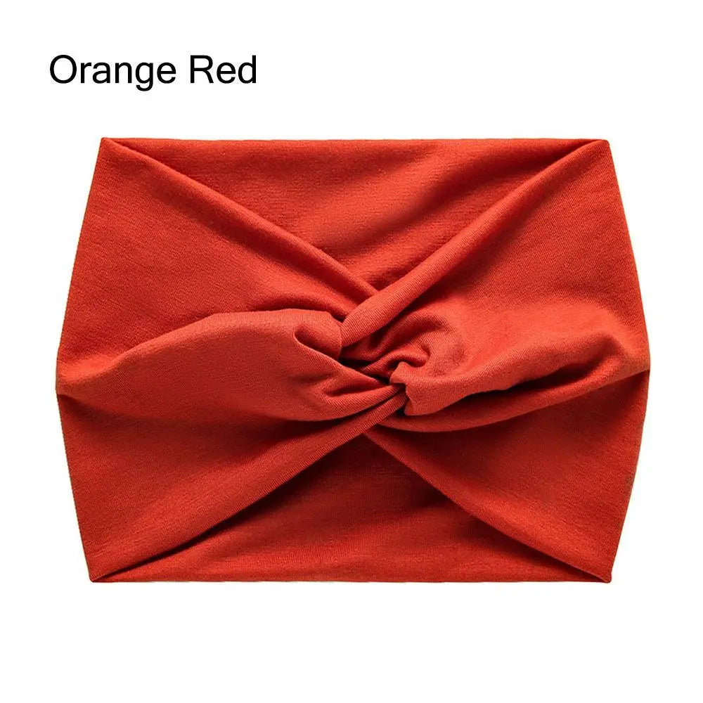 Orange red headband with a knot on a white background