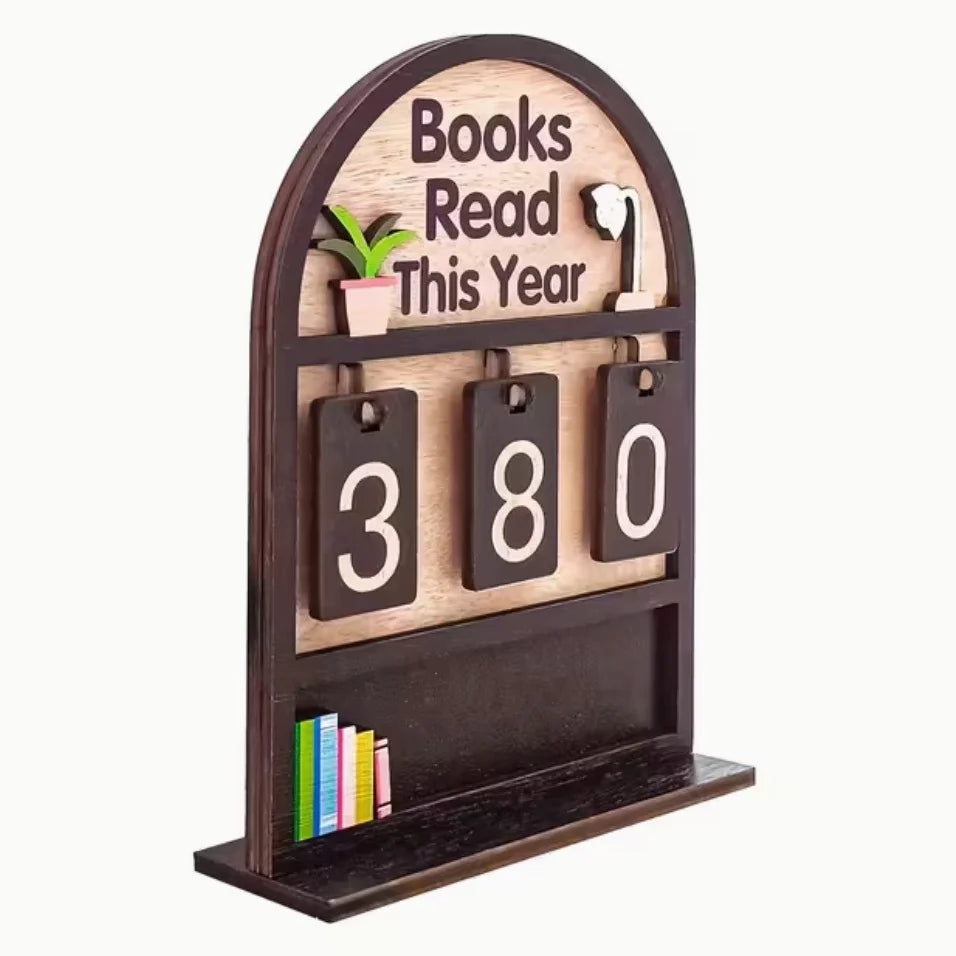 Wooden shelf with 'Books Read This Year' display showing '380' books read.