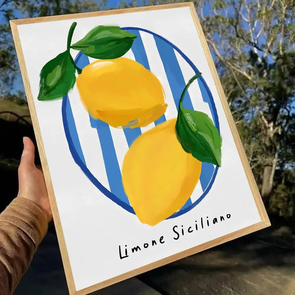 Framed artwork of lemons with green leaves and 'Limone Siciliano' text, held outdoors.