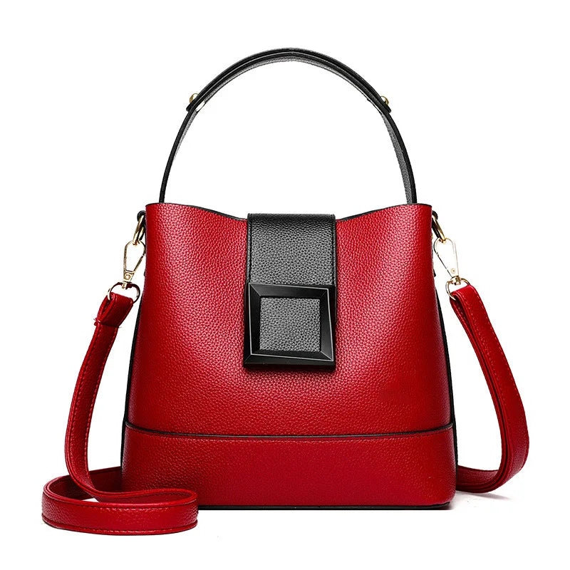 Red handbag with black accent on a white background