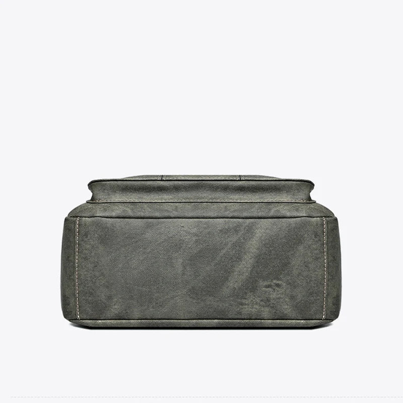 Women’s canvas crossbody shoulder bag with zip pockets and adjustable strap.  Bottom View