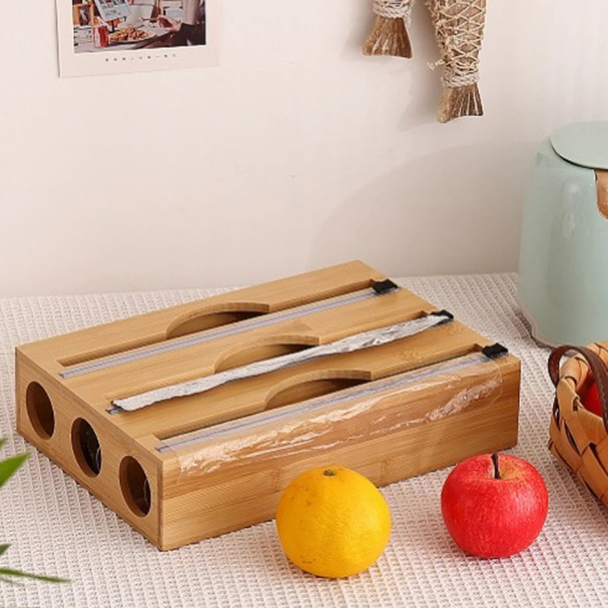 Bamboo kitchen wrap dispenser with integrated foil and cling film cutter