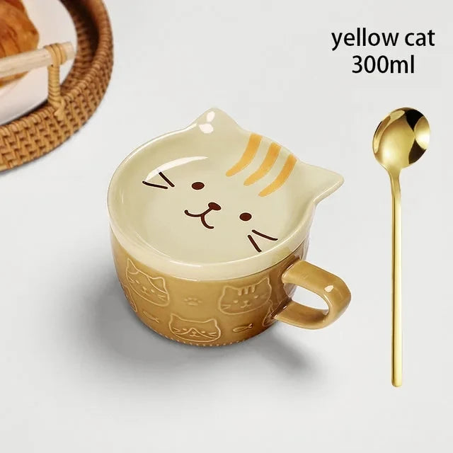 Cat-shaped mug with a gold spoon on a white background