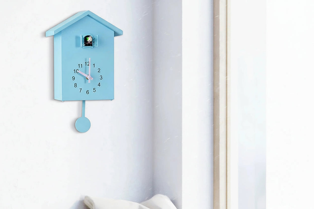 Blue cuckoo clock on a white wall 
