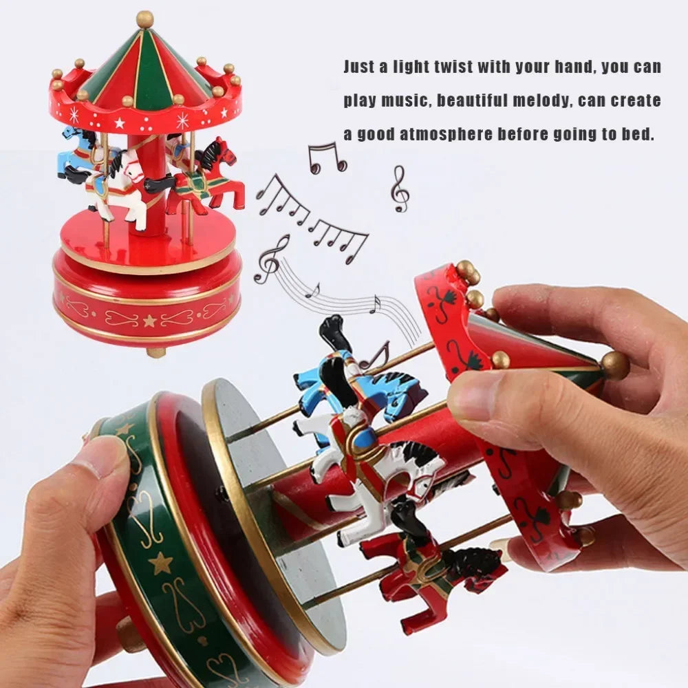 Red and green musical box with carousel design, held by a hand, on a white background.