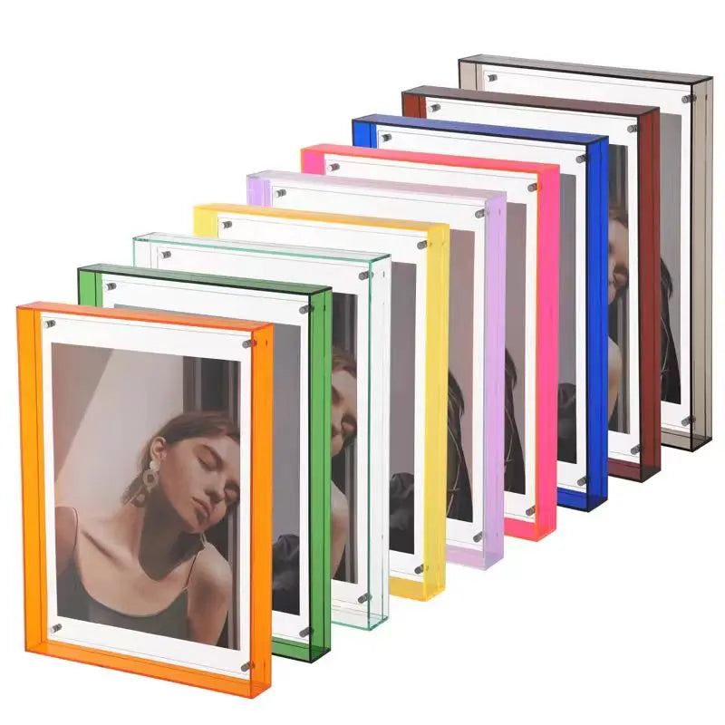 A set of slim rectangular picture frames shown in multiple colors, including orange, green, white, yellow, pink, blue, brown, and silver, arranged in a staggered row on a white background. Each frame holds a sample portrait photo.