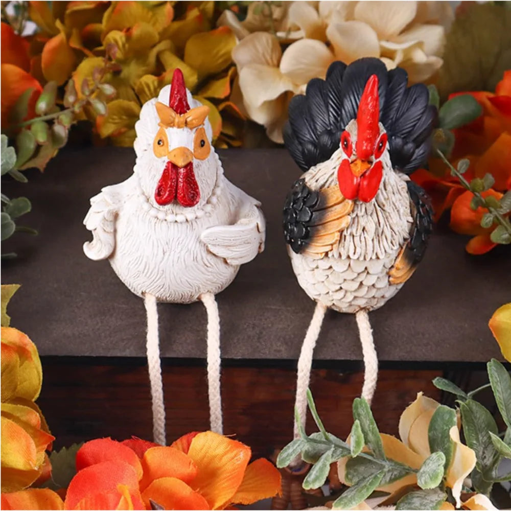 Two decorative rooster figurines on a floral background