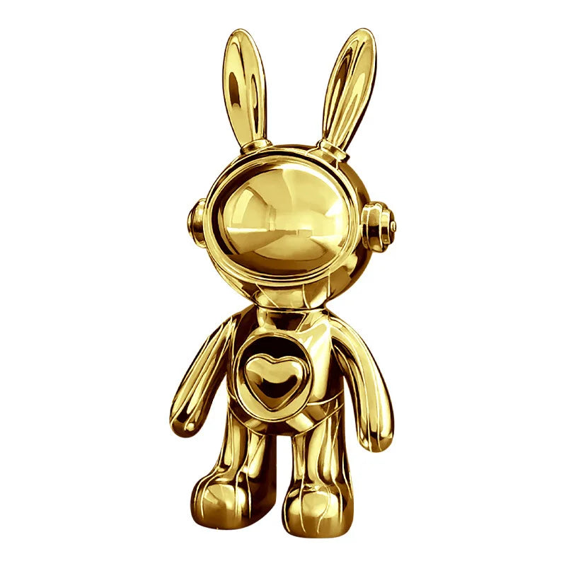 Gold rabbit-shaped figurine with a heart on a white background