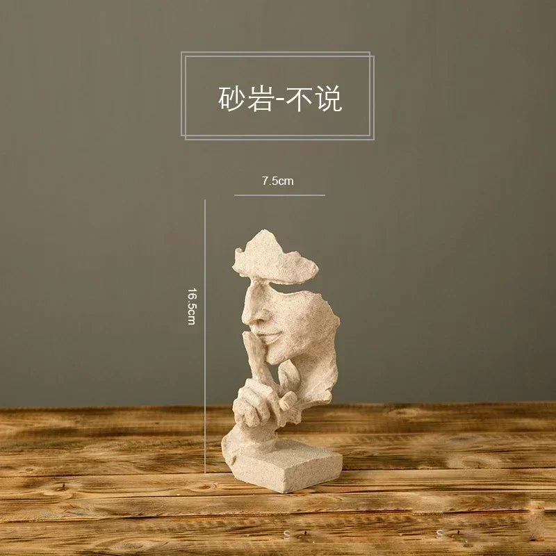 Stone sculpture of a face on a wooden surface with measurements indicated.