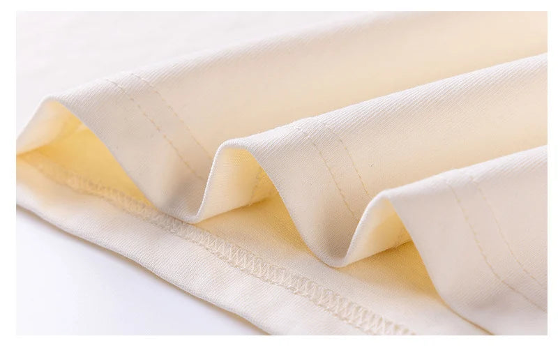 Close-up of beige fabric with a white background