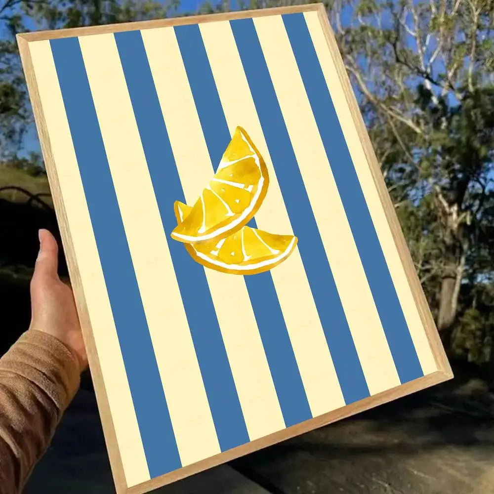 Framed artwork with blue and beige striped background and lemon slices.