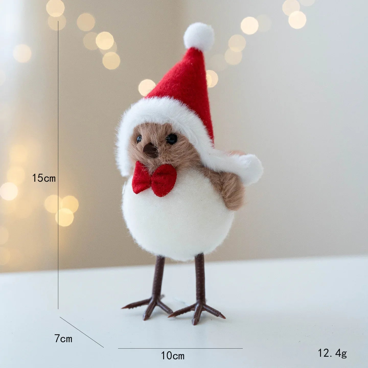 Small plush toy resembling a chick wearing a Santa hat and bow tie, with measurements indicated.