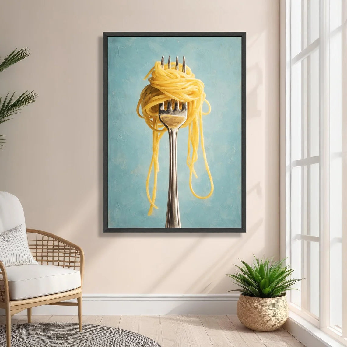 Framed artwork of spaghetti on a fork hanging on a wall in a room with a chair and plant.