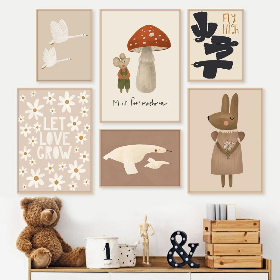 Children's wall art with illustrations of animals and objects, displayed on a white wall with a teddy bear and wooden shelf in the foreground.
