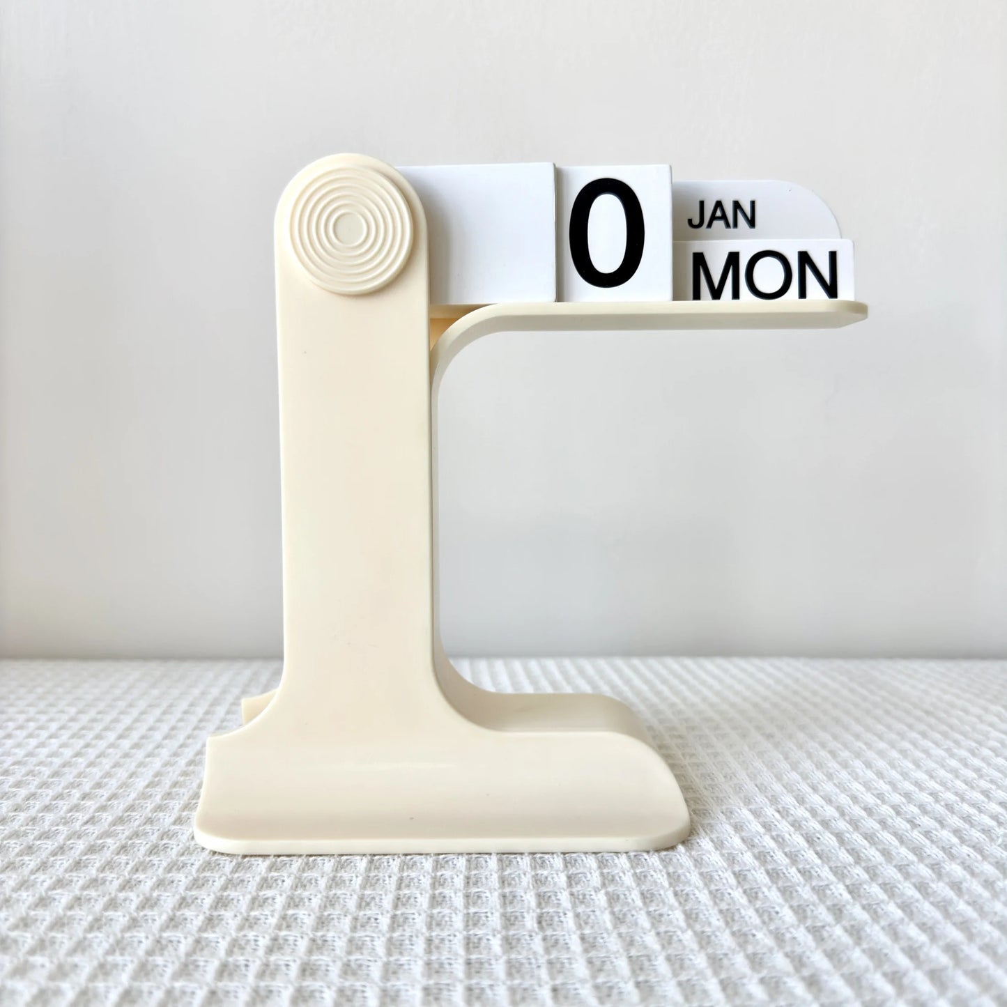 Calendar with a decorative stand on a textured surface