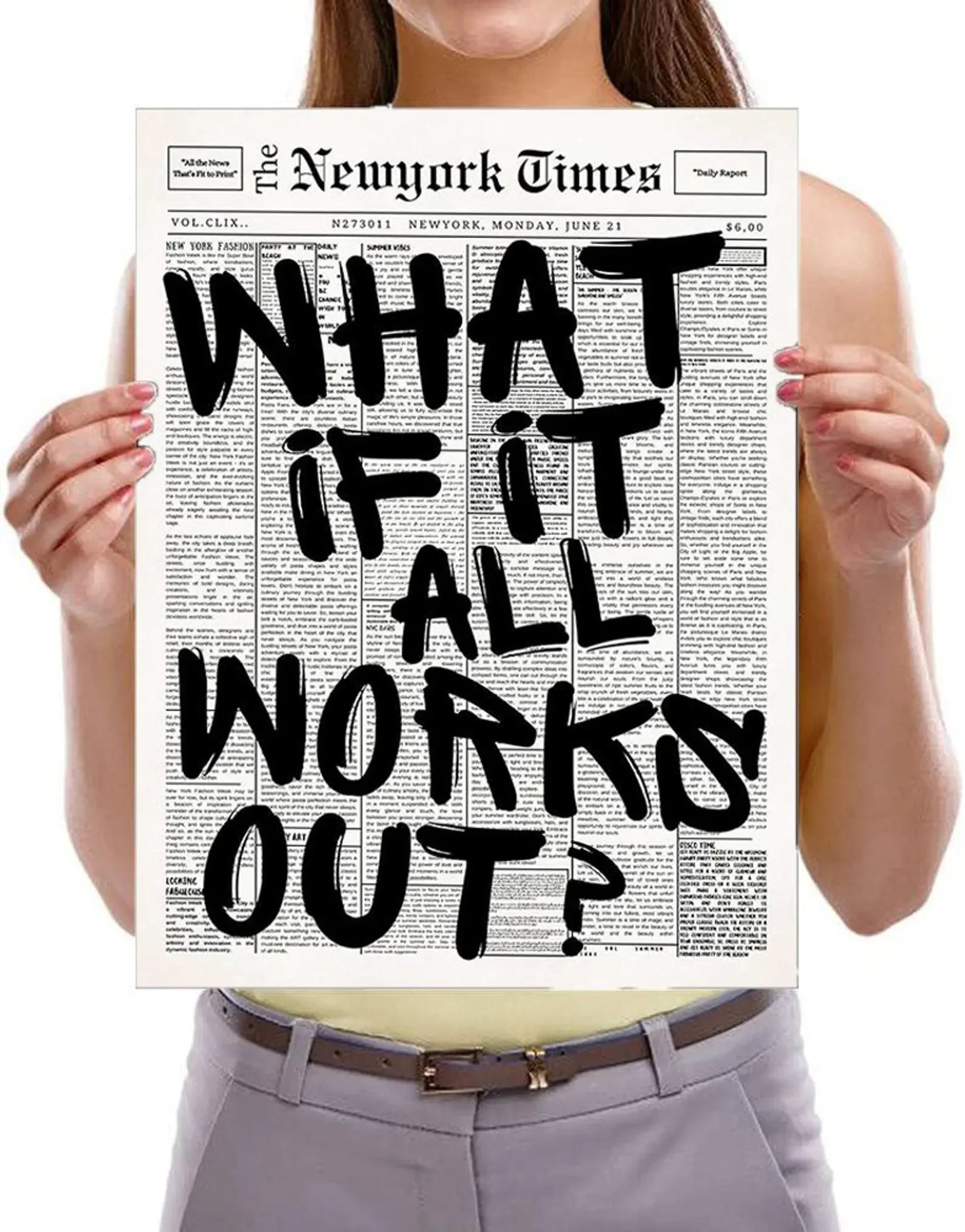 Person holding a New York Times newspaper with a headline 'What if it all works out?'