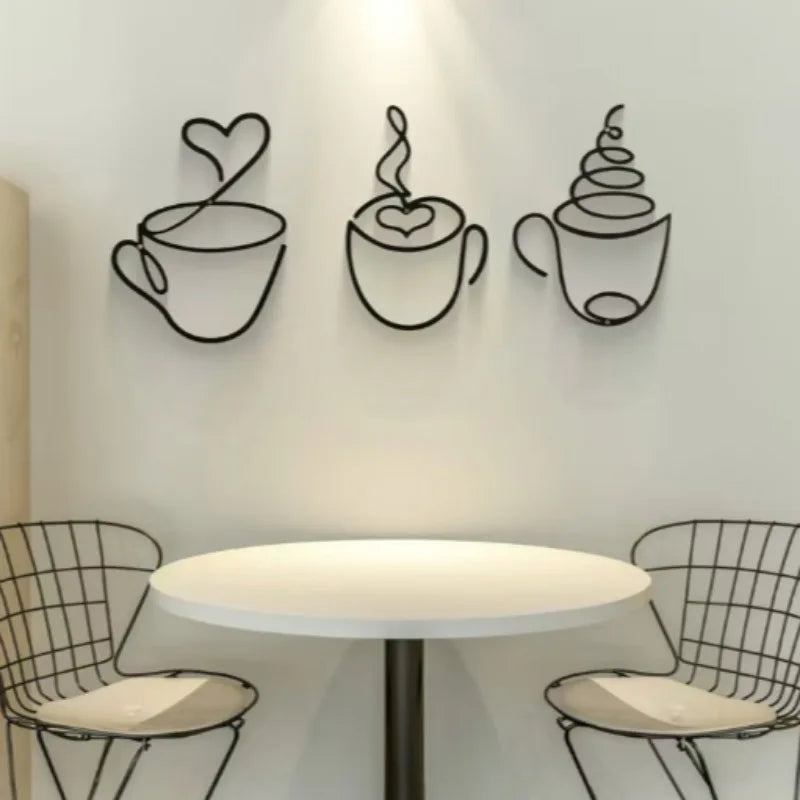 Decorative wall art of coffee cups with a round table and chairs in a cafe setting.