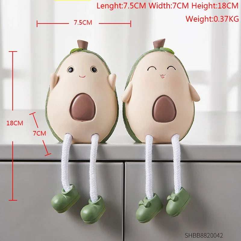 Two avocado-shaped plush toys with measurements on a white background
