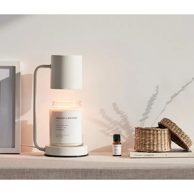 Candle with a diffuser on a shelf with a minimal background