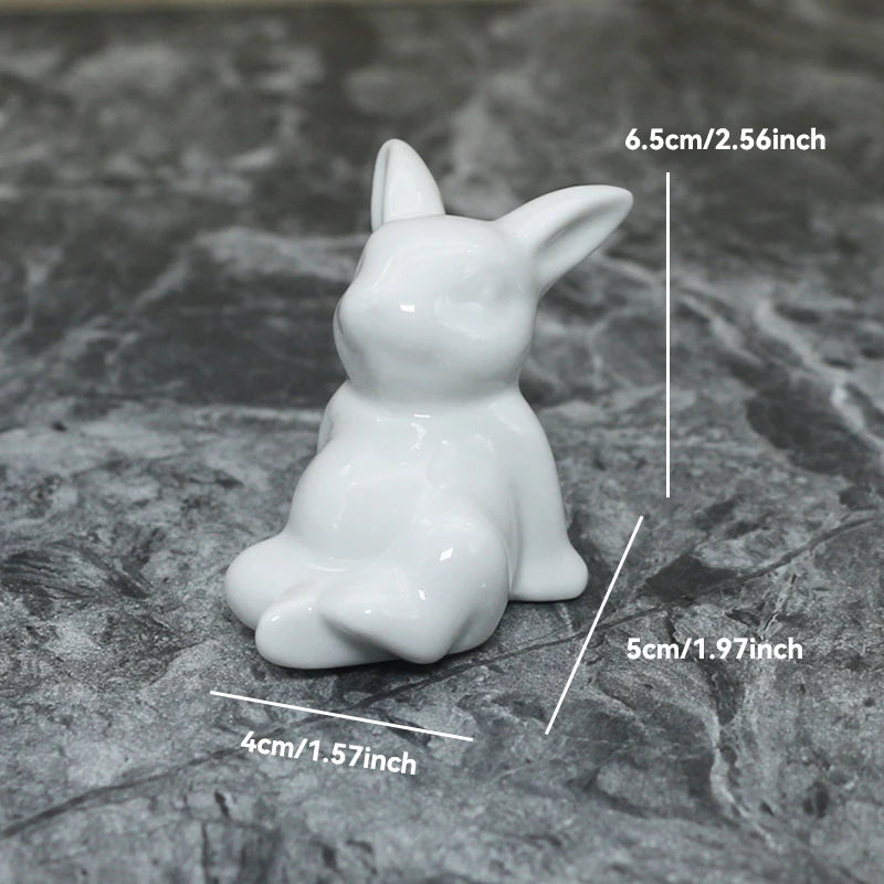 White ceramic dog figurine with measurements on a gray surface