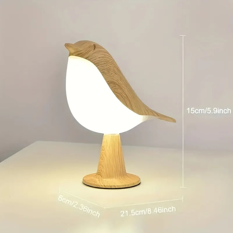 Bird-shaped lamp with measurements on a plain background