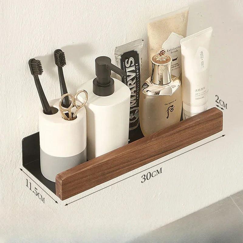 Bathroom shelf with toiletries including bottles, a brush holder, and a hairbrush.