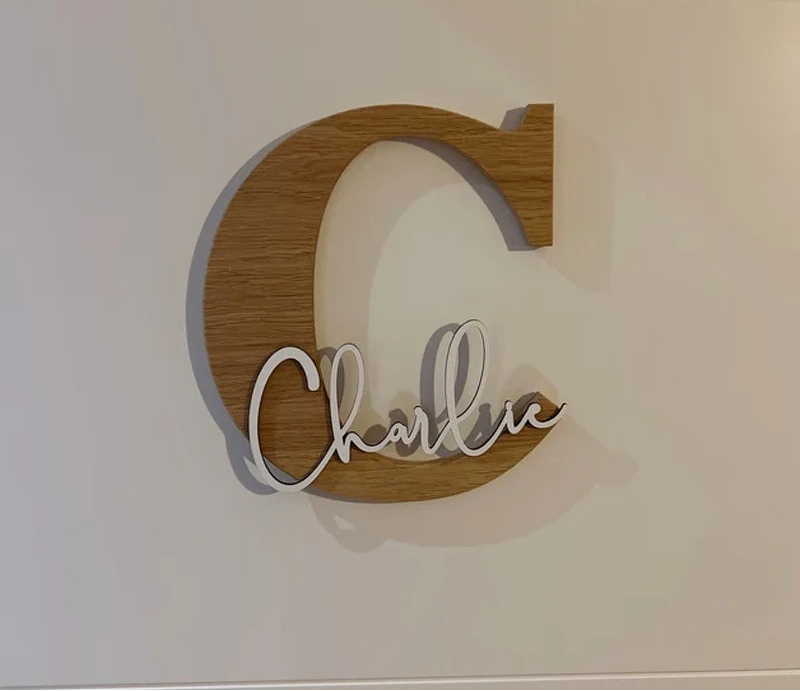 Wooden letter 'C' with white script on a light background