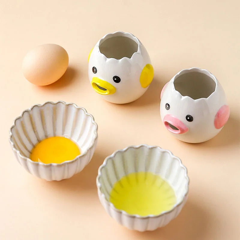Ceramic egg-shaped egg white separator with duck faces on a beige background