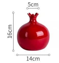 Red pomegranate with measurements on a white background