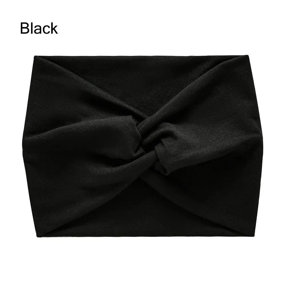 Black headband with a knot on a white background