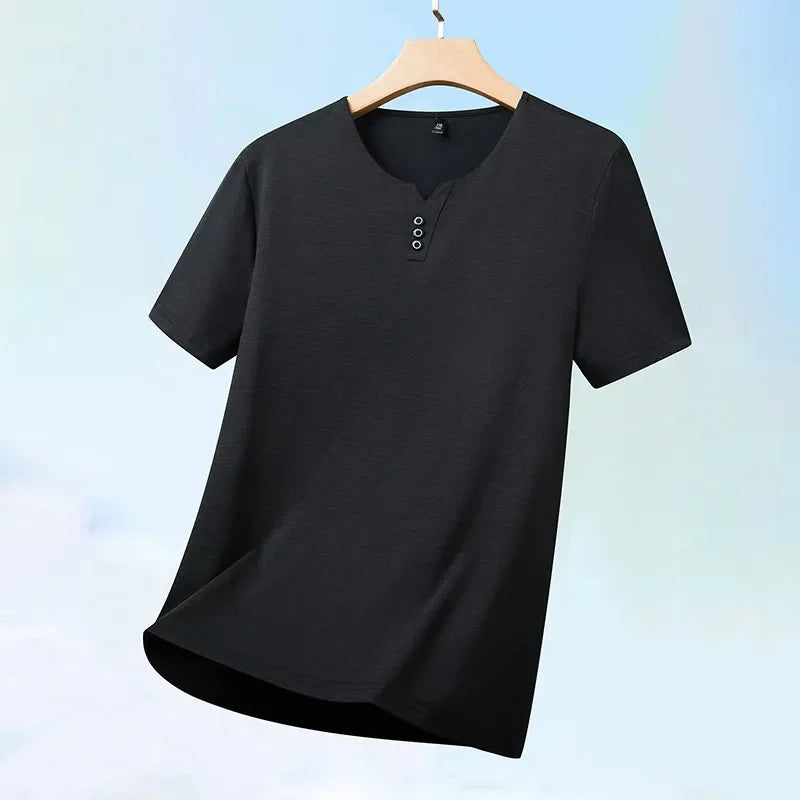 Black t-shirt on a wooden hanger against a light blue background