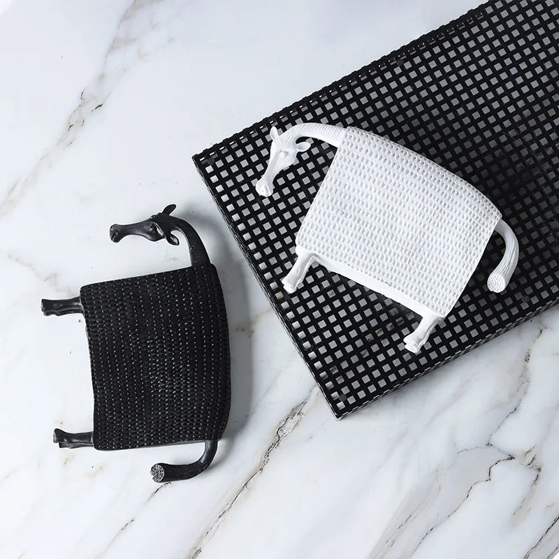 Abstract armoured horse sculpture in black and white resin with textured decorative armour, modern contemporary ornament for home decor.