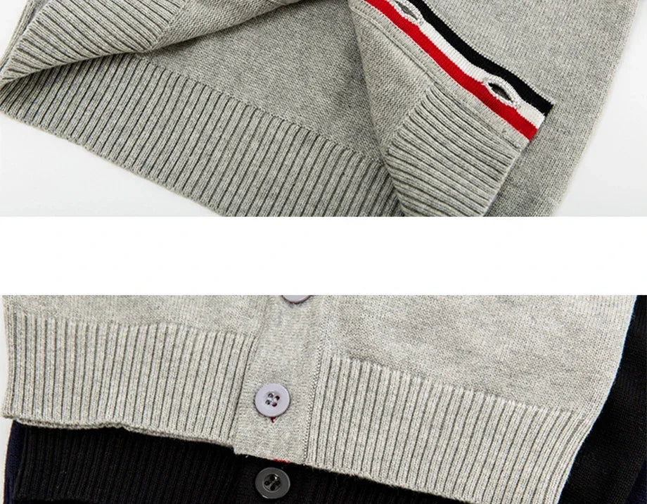 Gray cardigan with a striped sleeve detail on a white background