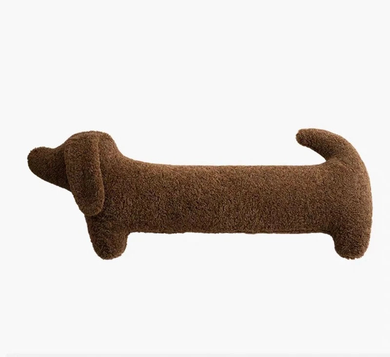 Brown dog-shaped cushion on a white background