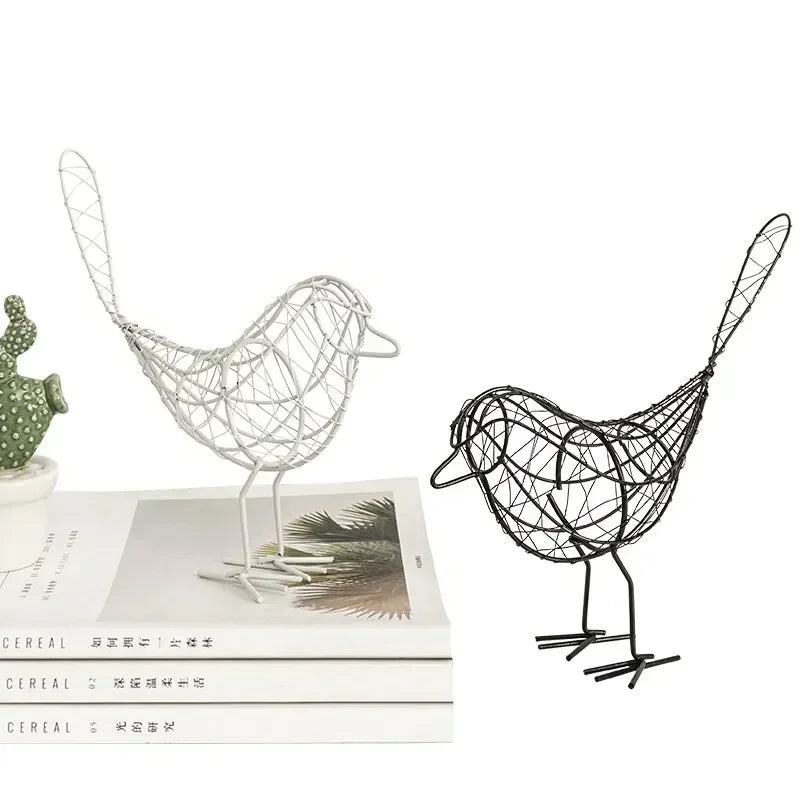 Minimalist iron bird sculpture ornaments styled on modern tabletop in Scandinavian-inspired interior