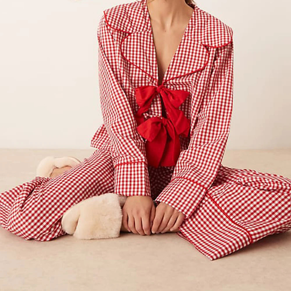 Red and white checkered pajama set with a large bow on a beige background