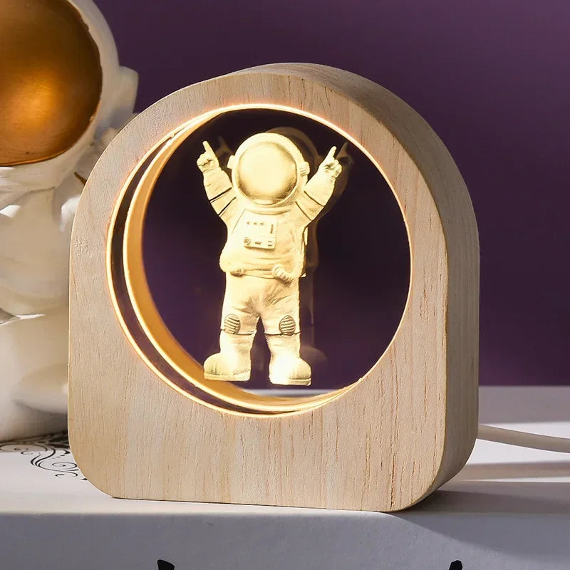 Wooden lamp with an astronaut figure inside on a purple background