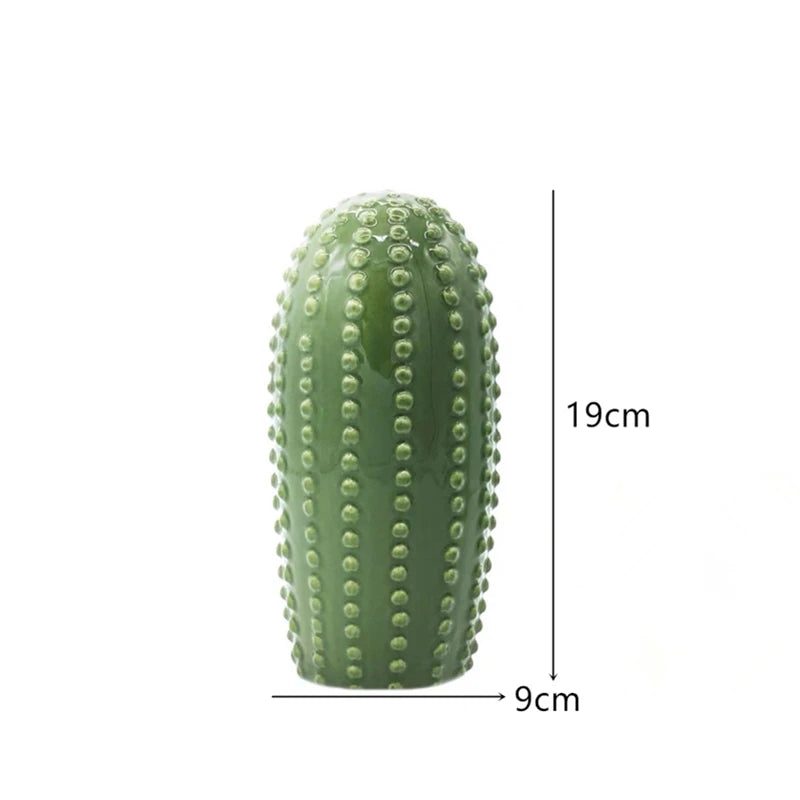 Green cactus-shaped object with measurements on a white background