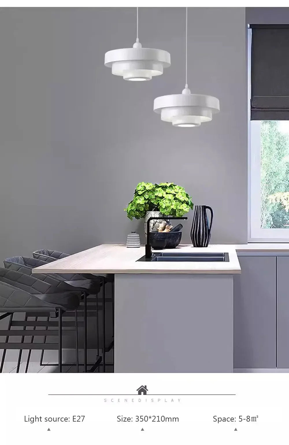 Modern kitchen with pendant lights, a sink, and a window.