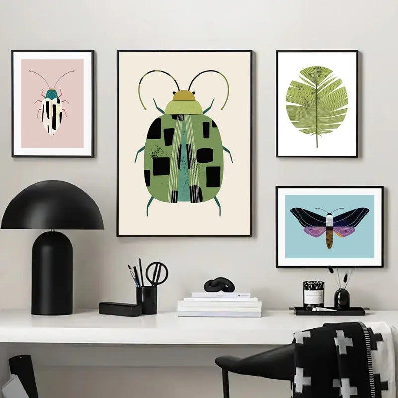 Modern office decor with framed artwork of a beetle, leaf, and butterfly on a wall.