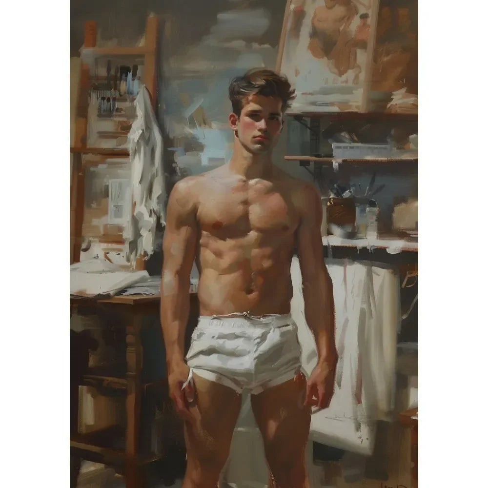 Man standing shirtless in a studio with art supplies and paintings in the background