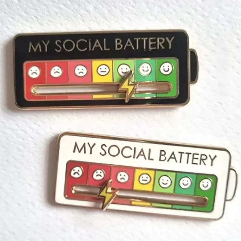 My Social Battery pin badge with sliding mood scale showing colourful emoticons from low to high energy.