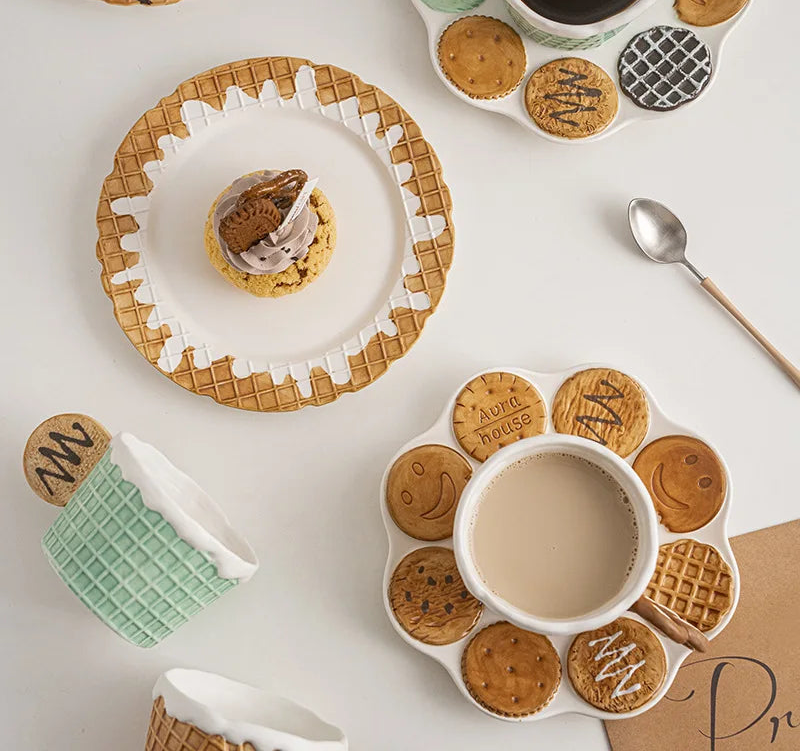 Decorative ceramic plates with cookie-shaped designs on a white surface.