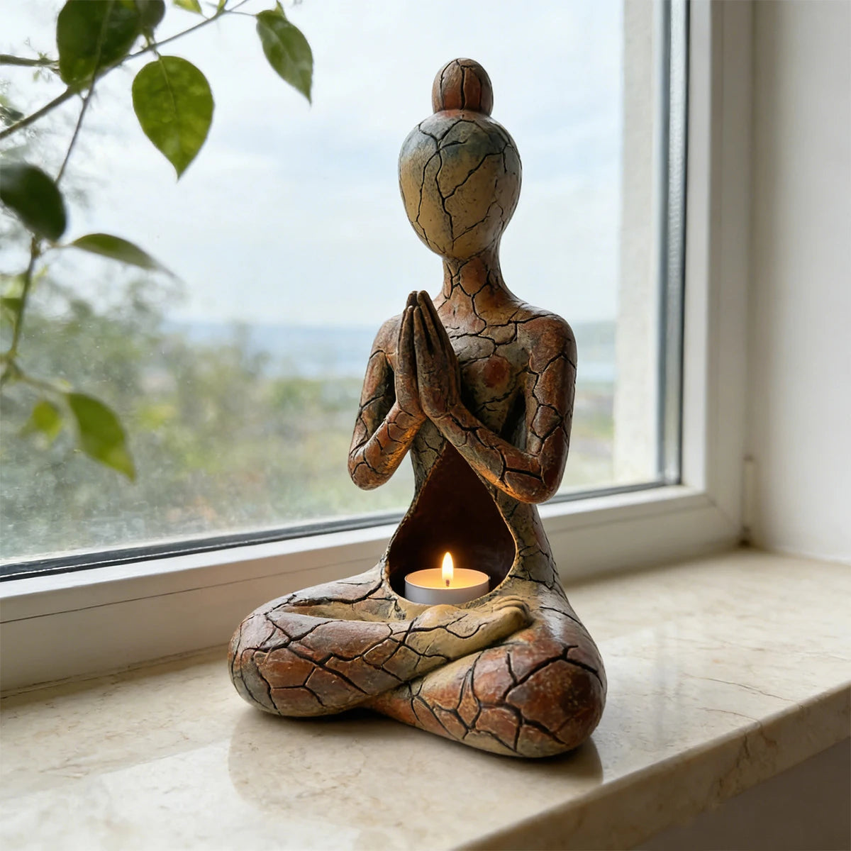 Artistic resin meditating figure ornament with a warm cracked-effect finish and hollow centre designed for a flameless LED candle.