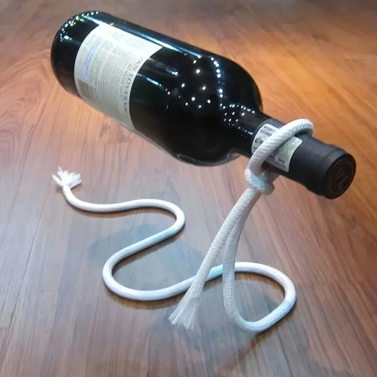 Floating rope wine bottle holder creating illusion of suspended bottle on wooden surface