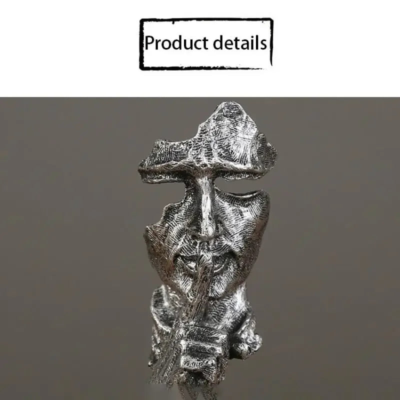 Metallic sculpture of a figure  on a gray background