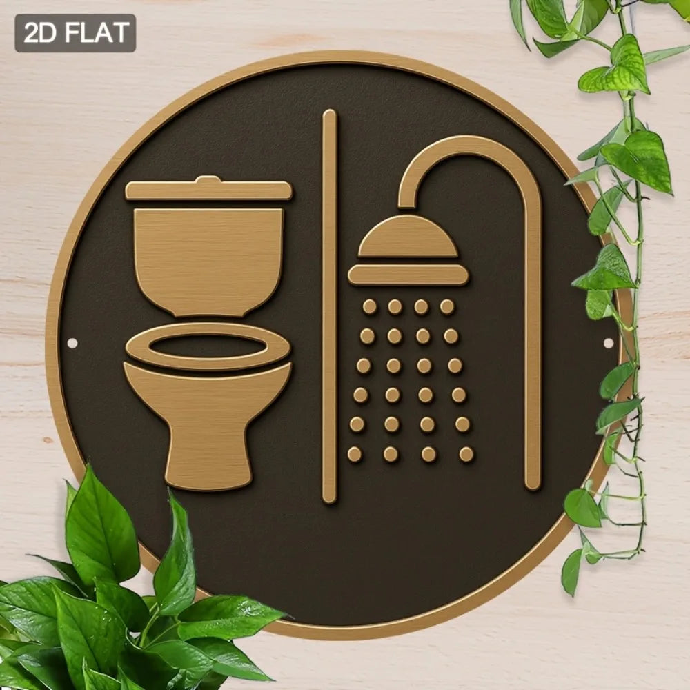 Decorative wall sign with toilet and shower icons on a brown background, surrounded by green leaves.
