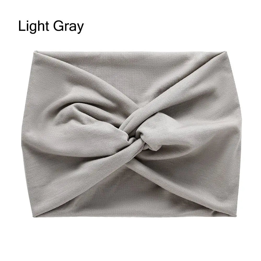 Light gray headband with a knot on a white background